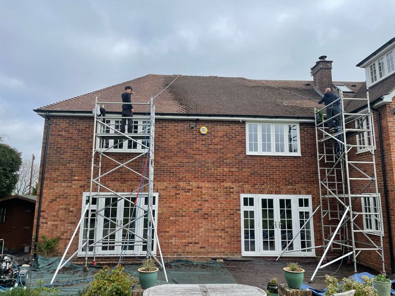 Roof cleaning carried out safely from scaffold towers by The Roof Moss Cleaners in London Colney
